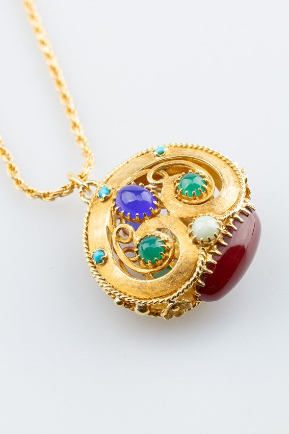 Massief gouden hanger met diverse edelstenen aan gouden collier