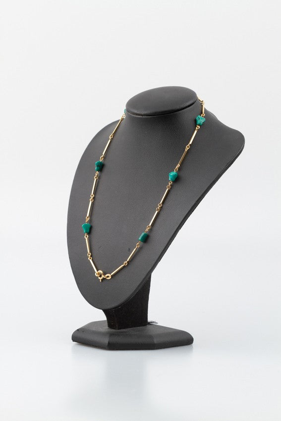 Gouden schakelcollier met turkoois