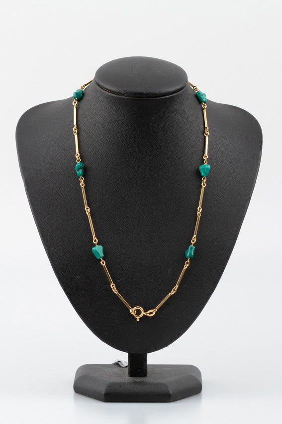 Gouden schakelcollier met turkoois