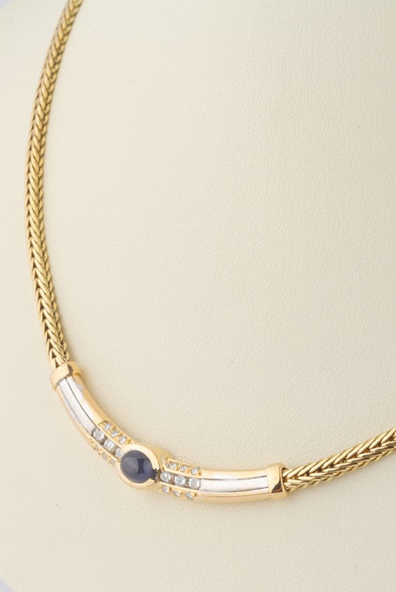 Wit/geel gouden collier van het merk Le Chic met saffier en briljant