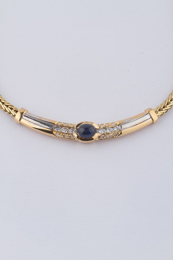 Wit/geel gouden collier van het merk Le Chic met saffier en briljant