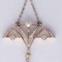 Antieke platina/goud Art Nouveau hanger aan collier met een diamant, briljanten en parels