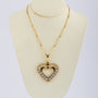 Gold heart pendant with 120 diamonds on a gold necklace