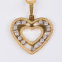 Gold heart pendant with 120 diamonds on a gold necklace