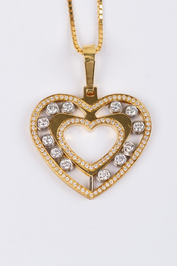 Gold heart pendant with 120 diamonds on a gold necklace