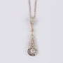 Antique white/yellow gold Art Deco pendant on a white gold necklace