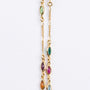 Gold link necklace with various glass colored stones