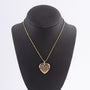 Gouden hart medaillon aan gouden collier
