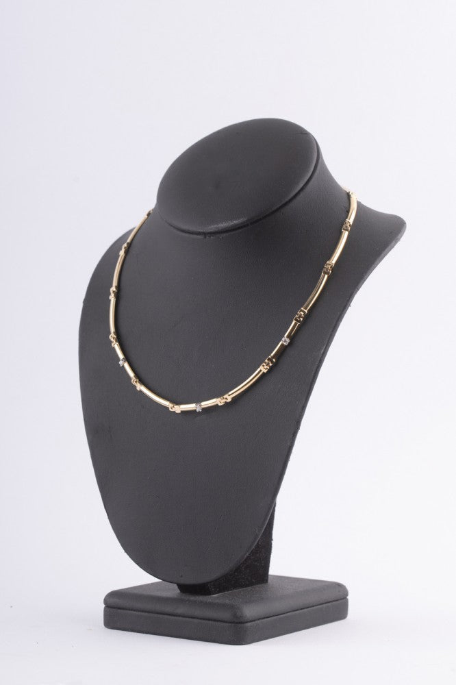 Gouden schakel collier met 3 briljanten