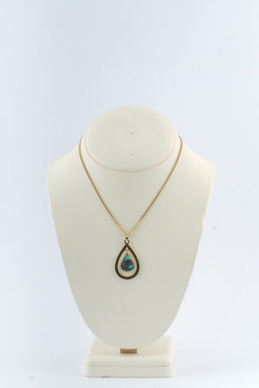 Gouden hanger met turkoois aan gouden collier