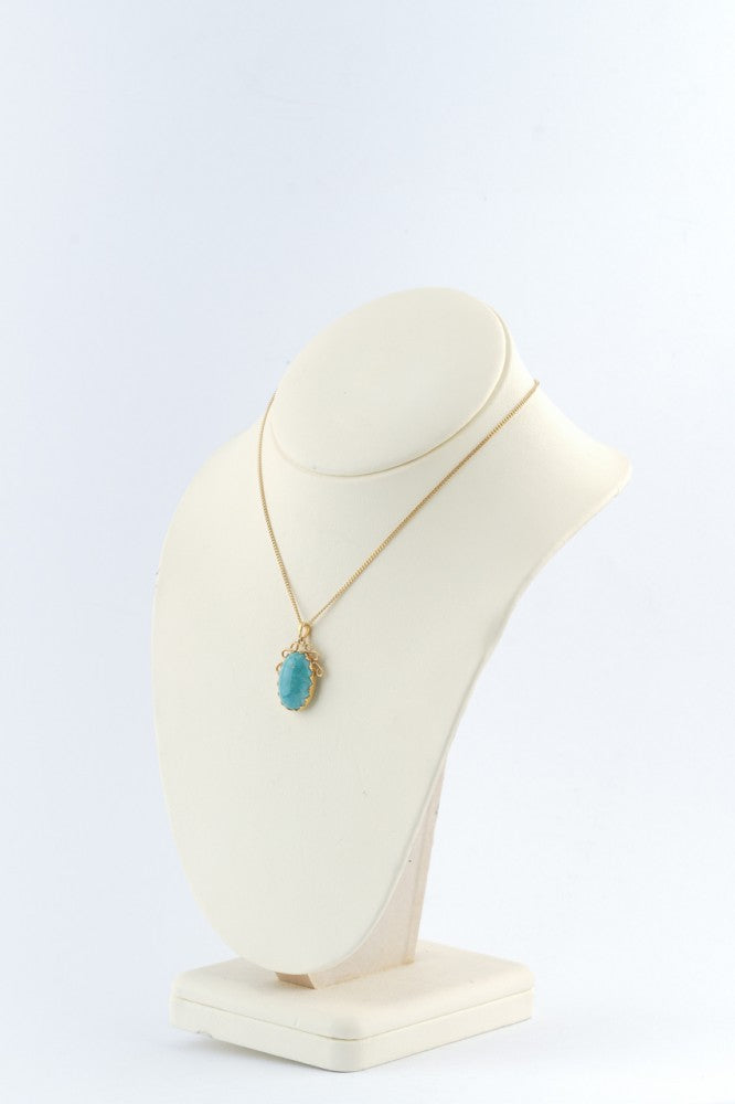 Gouden hanger met turkoois aan gouden gourmet collier