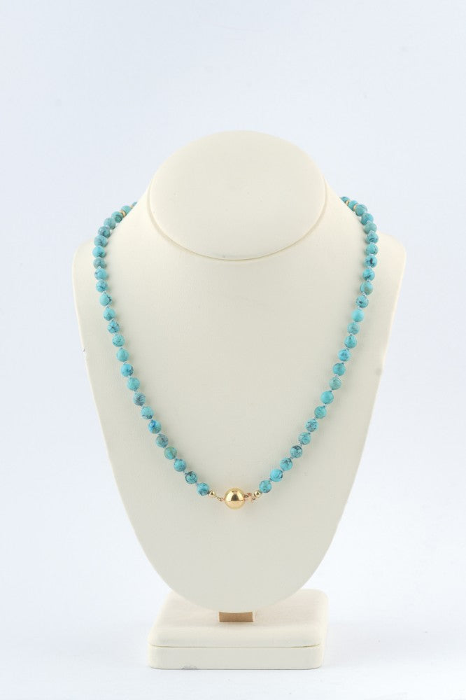 Turkoois collier aan gouden bolsluiting
