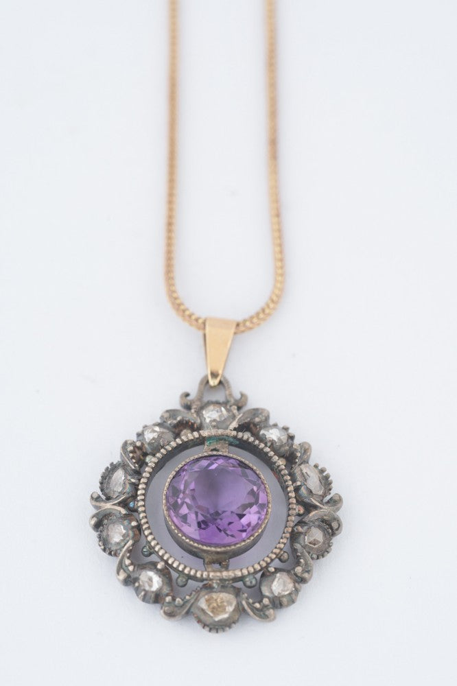 Gold/silver pendant with amethyst and diamonds on a gold foxtail necklace