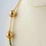 Schoeffel parel collier met gouden tussen schakels en smaragden