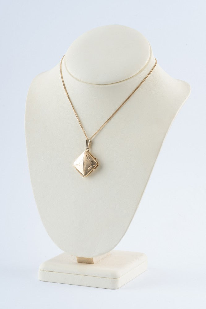 Gouden medaillon aan gouden gourmet collier