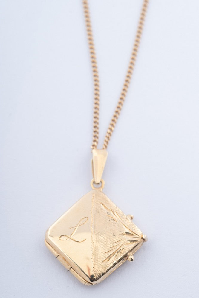 Gouden medaillon aan gouden gourmet collier