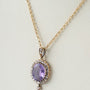 Gouden hanger met amathisten en diamanten aan gouden collier