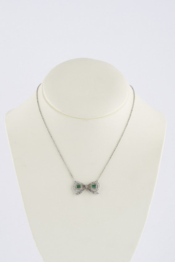 Antiek platina strik collier met smaragd en briljanten