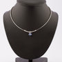White gold necklace with brilliant and sapphire