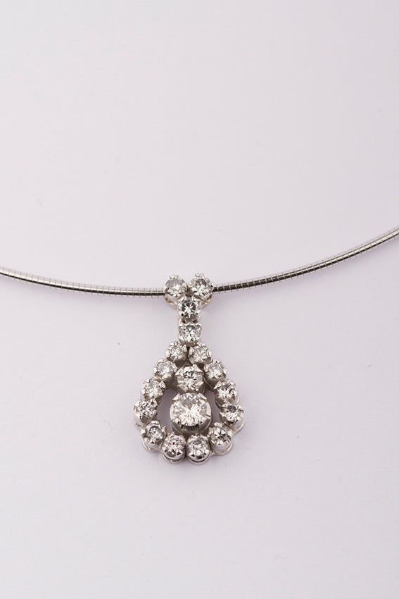 White gold pendant with brilliant cut diamond on omega necklace