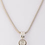 White gold solitaire pendant on a white gold necklace
