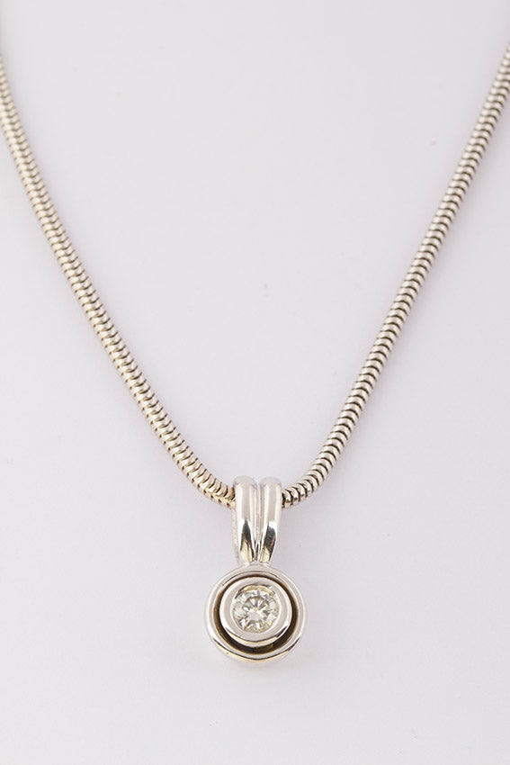 White gold solitaire pendant on a white gold necklace