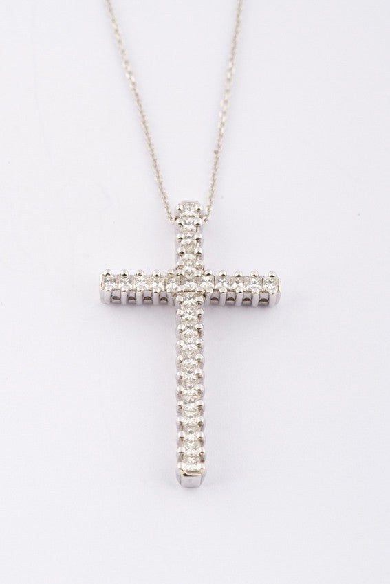 White gold cross with 28 diamonds on a necklace.