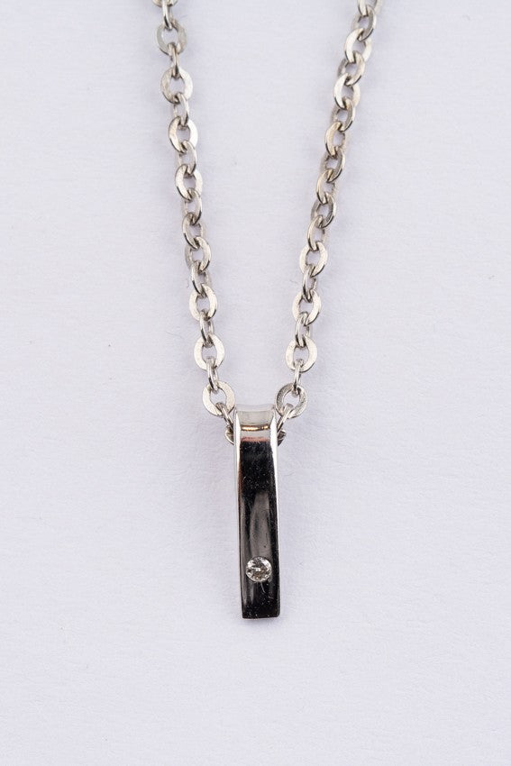 White gold pendant with a brilliant on a white gold necklace