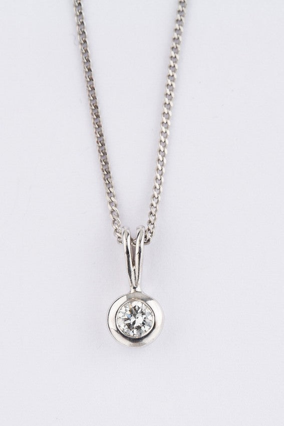 White gold solitaire pendant with a brilliant on a white gold necklace
