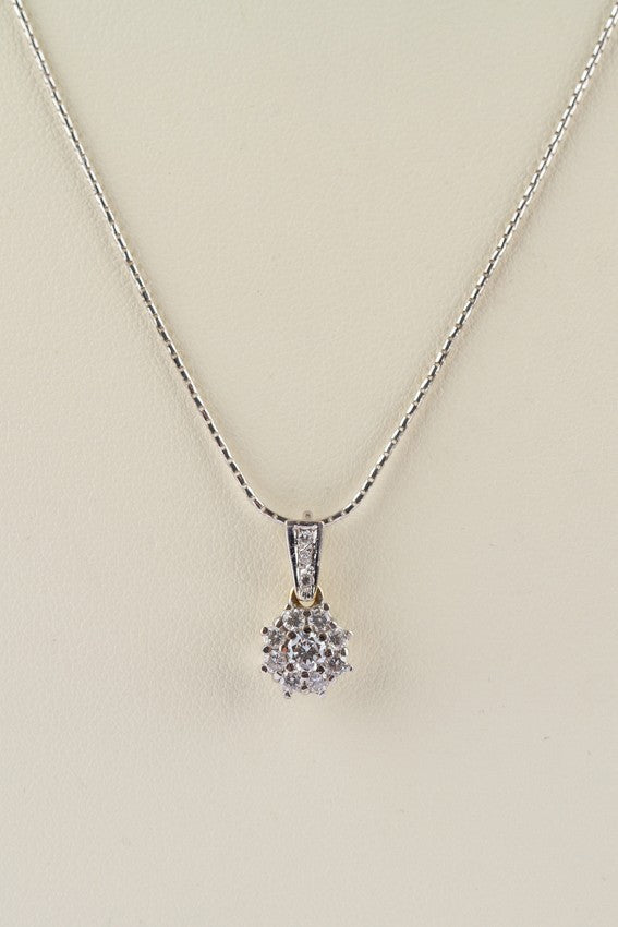 White gold pendant with 12 diamonds on a white gold necklace