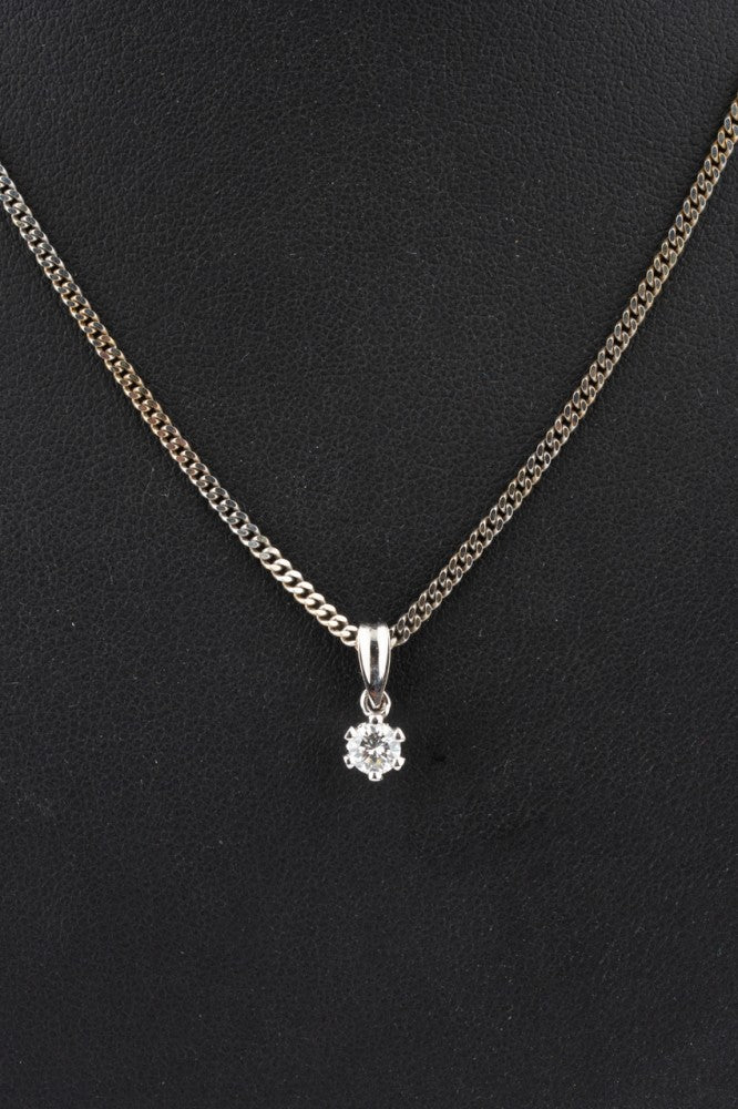 White gold solitaire pendant with a brilliant on a white gold necklace