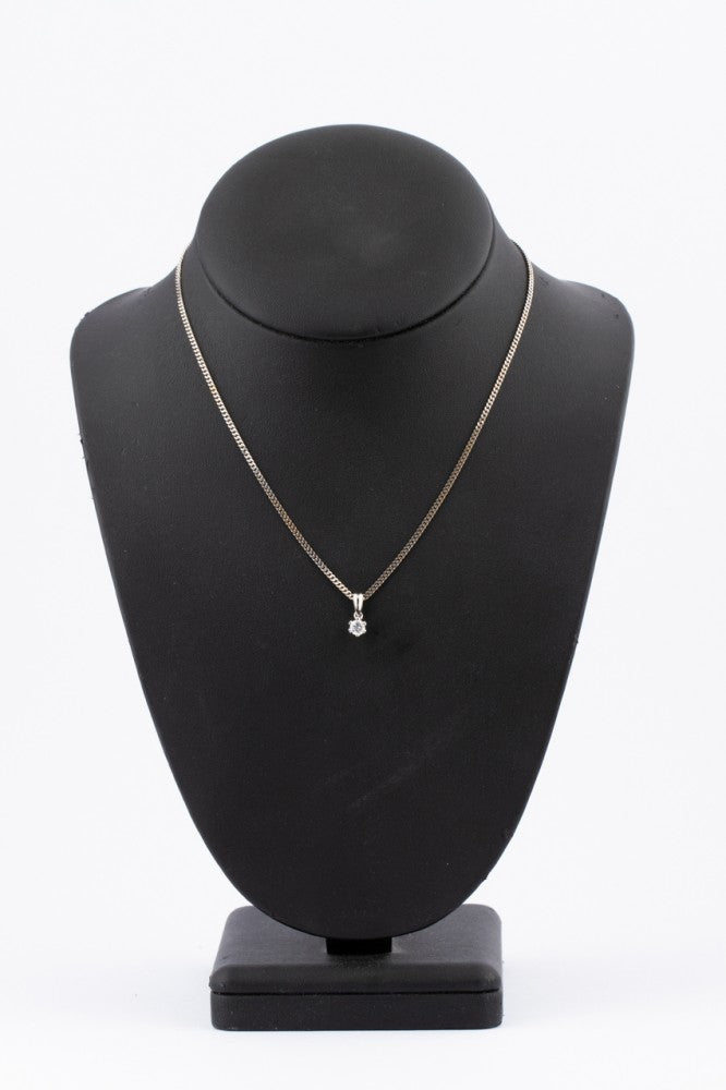 White gold solitaire pendant with a brilliant on a white gold necklace