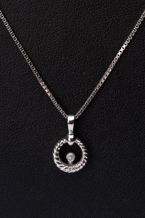 White gold pendant with a brilliant on a white gold necklace