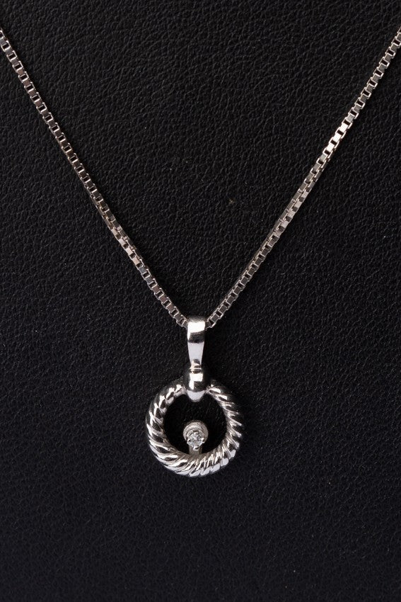 White gold pendant with a brilliant on a white gold necklace
