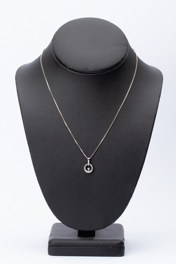 White gold pendant with a brilliant on a white gold necklace