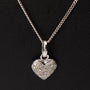 White gold heart pendant with diamonds on a white gold necklace