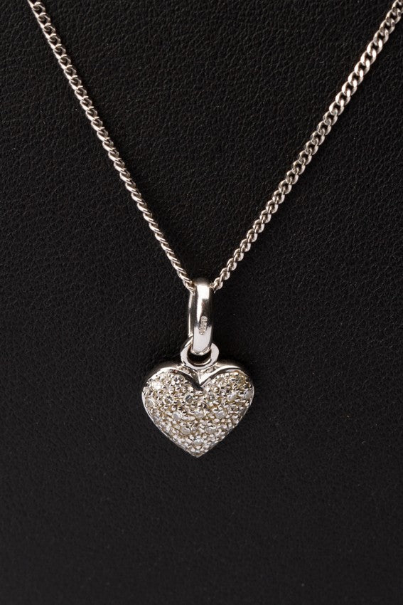 White gold heart pendant with diamonds on a white gold necklace