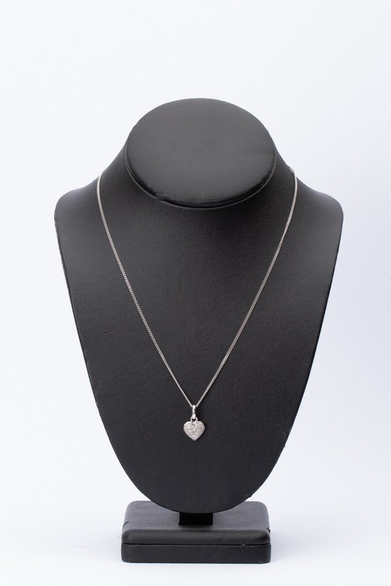 White gold heart pendant with diamonds on a white gold necklace