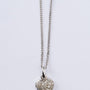 White gold heart pendant with diamonds on a white gold necklace