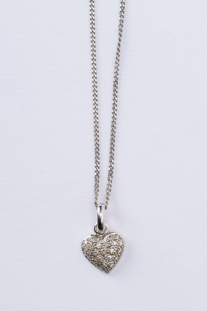 White gold heart pendant with diamonds on a white gold necklace