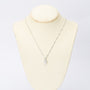 white gold pendant with a pear-shaped cut diamond on a white gold necklace