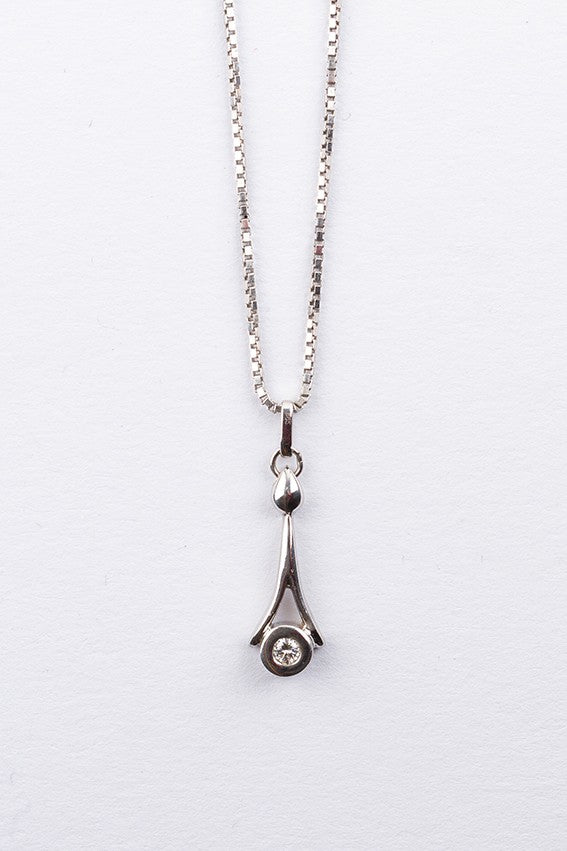 White gold pendant with a brilliant on a white gold necklace