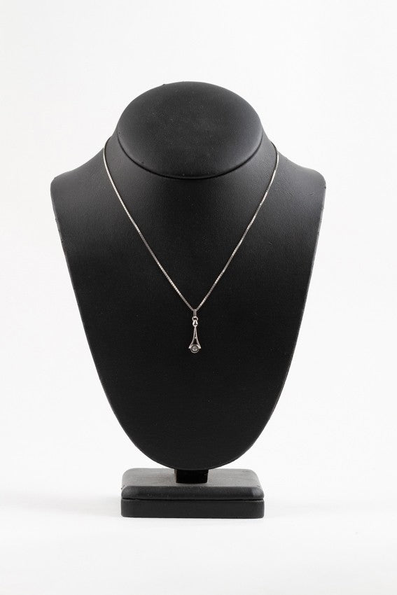 White gold pendant with a brilliant on a white gold necklace