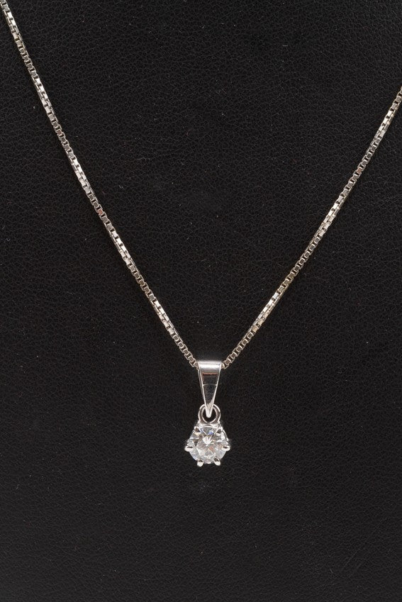 White gold solitaire pendant with a brilliant on a white gold necklace