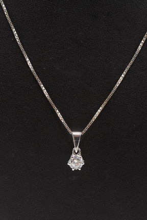 White gold solitaire pendant with a brilliant on a white gold necklace