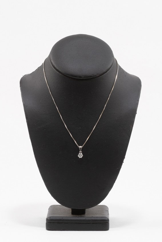 White gold solitaire pendant with a brilliant on a white gold necklace