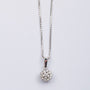 White gold double entourage pendant with diamonds on a white gold necklace