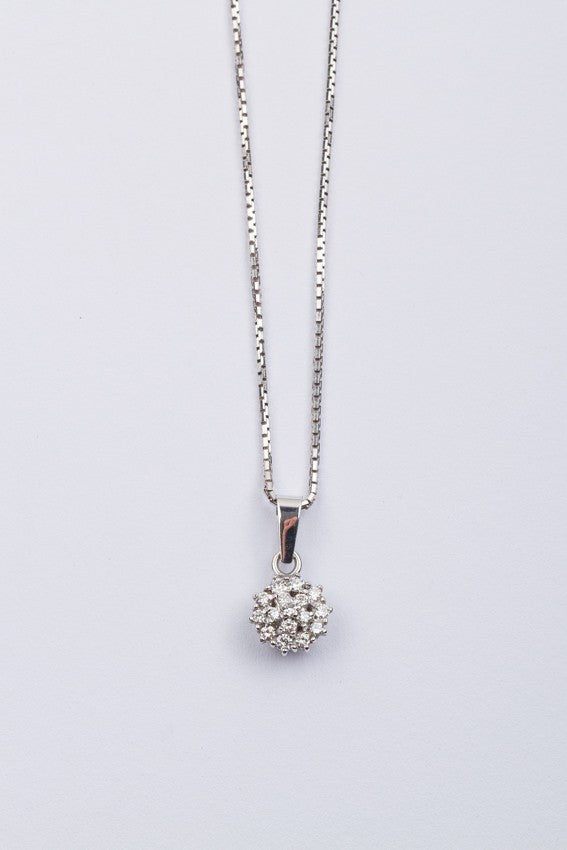 White gold double entourage pendant with diamonds on a white gold necklace