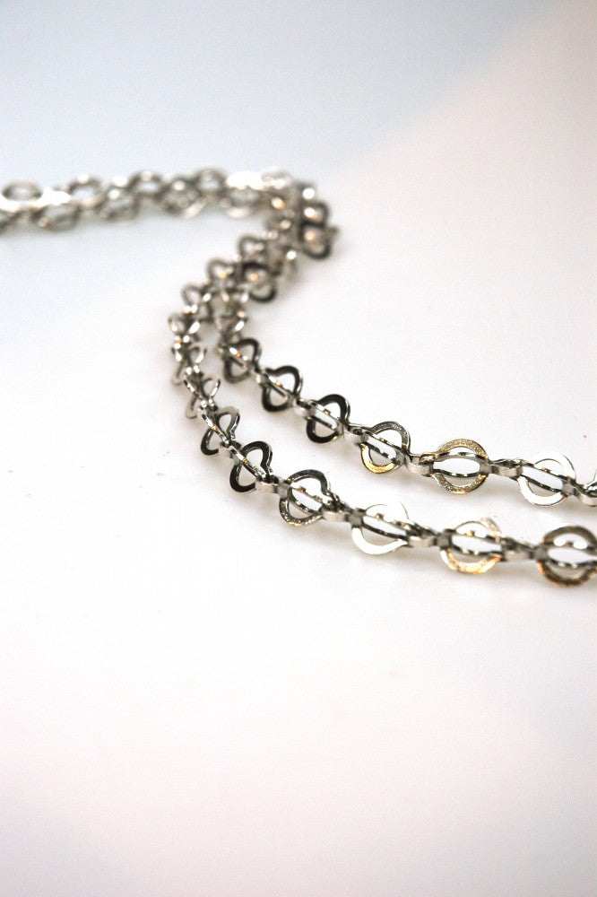 Long silver link necklace.