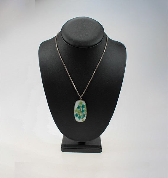 Silver pendant with porcelain
